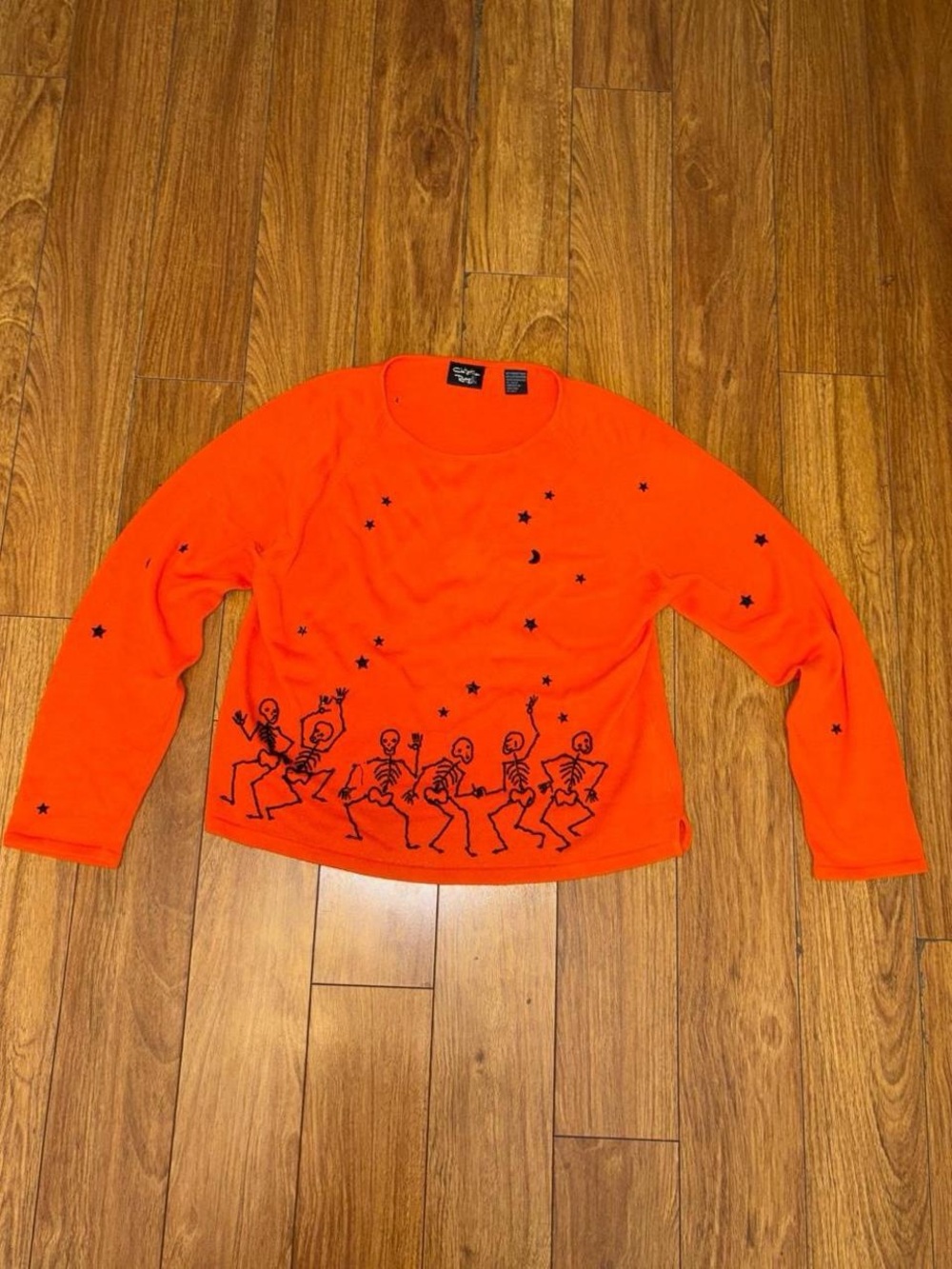 Orange beaded sweater with skeleton design